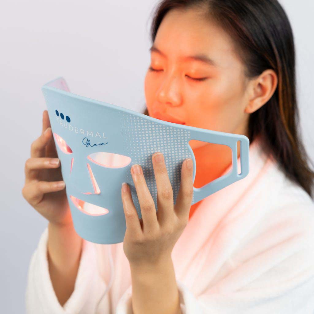 LED light therapy mask 3 lights shining on face